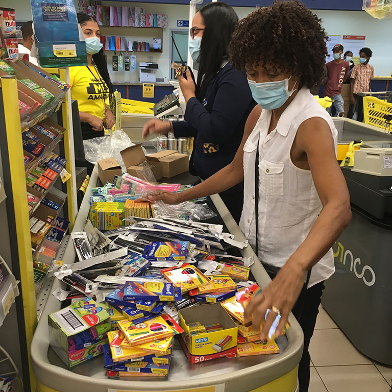 woman sorting through donated supplies
